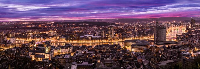 Cityscape from Mountain de Bueren in Liege Belgium at dusk. The river Maas leads through the scenery.