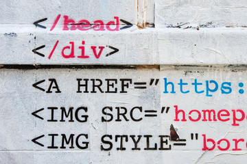 HTML stencil graffiti on brick wall