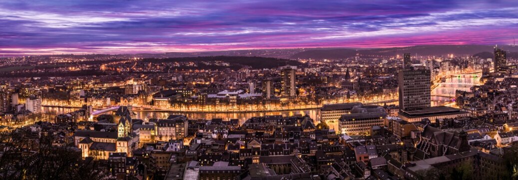 Cityscape from Mountain de Bueren in Liege Belgium at dusk. The river Maas leads through the scenery.