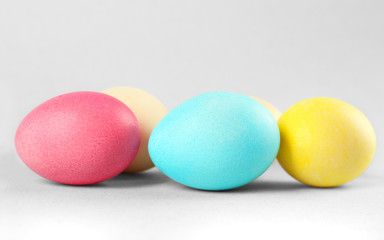 Colourful Easter eggs on light background