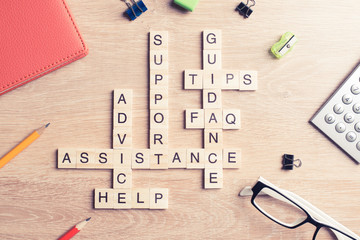 Conceptual media keywords on table with elements of game making crossword