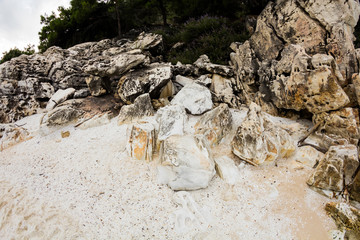 Saliara Beach (called Marble Beach), beautiful white beach in Thassos island, Greece. Landscape with water and rocks at sunset. Fish eye lens effects
