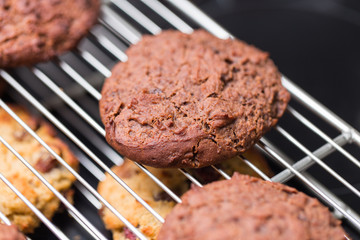 baked chocolate cookies laying on a rack