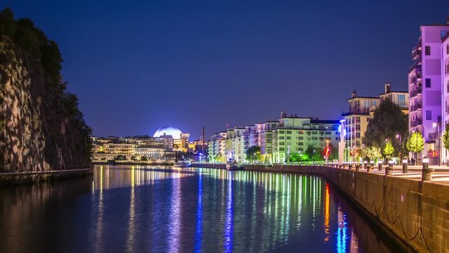Time Lapse of city river at night. Stockholm Ericsson Globe in the background