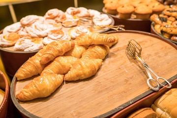 croissant & Variety of bakery products in a bakery shop
Fresh bakery products - close up shot.