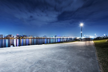Fototapeta premium cityscape and skyline modern city at night from footpath