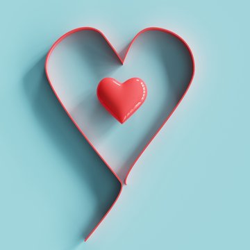 Tiny red heart in middle shapes heart made by paper on blue pastel background. minimal concept idea.