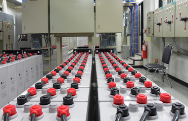 Room with many cables and many batteries.