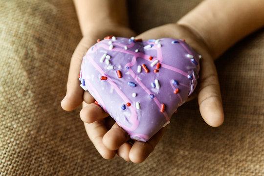 Heart Shaped Biscuit Cookie In Child’s Hands, Selective Focus