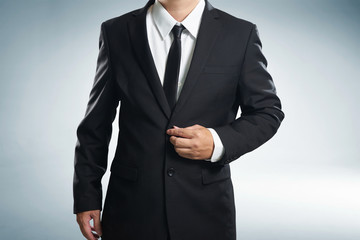 Obraz na płótnie Canvas Confidence businessman in black suit , close up .