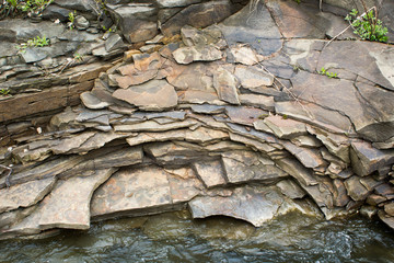 The slate stones on the banks of the river