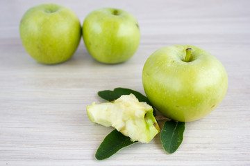 Three green apples on the table