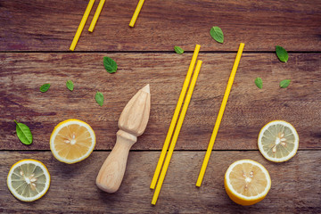 Fresh lemon and wooden juicer for summer juice and cocktail. Fre