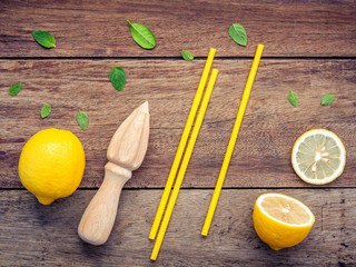 Fresh lemon and wooden juicer for summer juice and cocktail. Fre