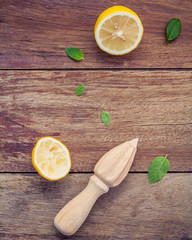 Fresh lemon and wooden juicer for summer juice and cocktail. Fre