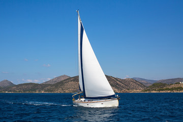 Fototapeta na wymiar Luxury yachts. Sailing ship boats with white sails in the Sea.