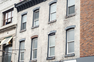 Fototapeta na wymiar Old urban building facade wall with windows