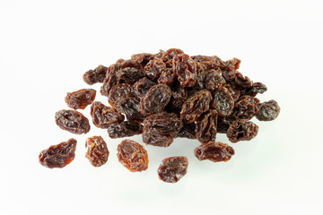 Dried raisins on white background.