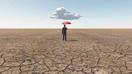 Man in desert with umbrella and single cloud