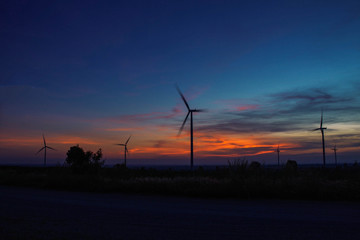 Wind turbines with silhouettes.
