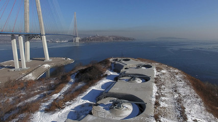 Golden Bridge in the city of Vladivostok. Beautiful bridge over the bay. Fortifications of Vladivostok fortress © Alena