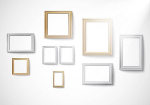 Blank gold and silver picture frame template isolated on wall with light Vector
