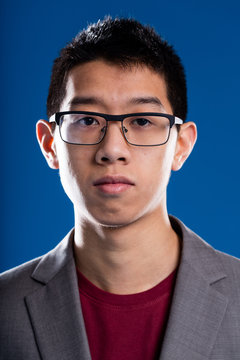 asian descent man with glasses portrait