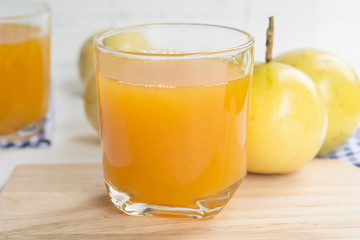 passion fruit and Juice in glass on wood table