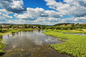 Fototapeta na wymiar Beautiful rural landscape with river and clouds