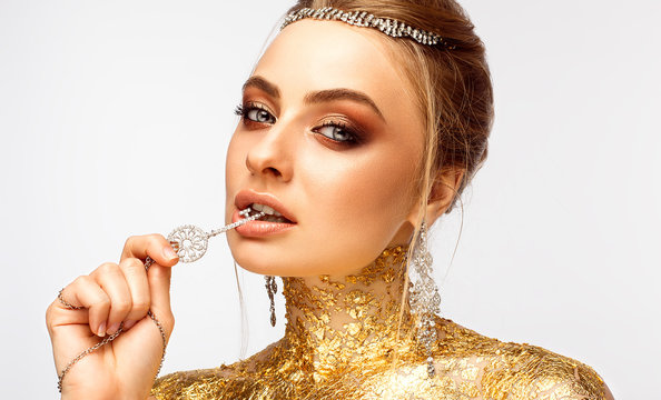 Girl with make-up. Girl with expensive jewelry