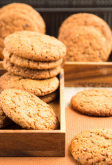 Group of oatmeal cookies in two wooden boxes