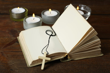 Open bible with crucifix. The concept of religion.