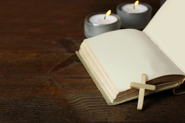 Open bible with crucifix. The concept of religion.