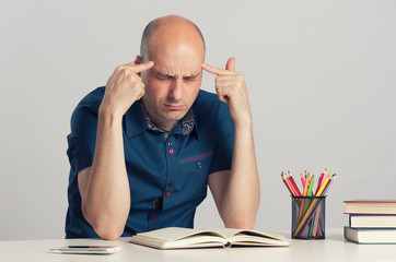 bald guy serious thinking