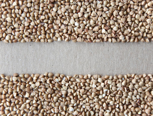 Texture of buckwheat on a cardboard surface. Empty place.