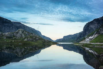 Norwegian lake with dramatic sky at sunset
