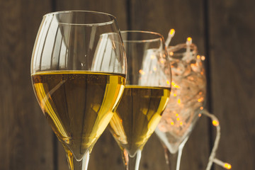 Two glasses of wine and fairy lights