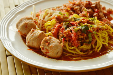 Chinese egg noodle dressing spicy pork ball with dried shrimp soup