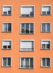Fototapeta premium Modern light orange housing block exterior