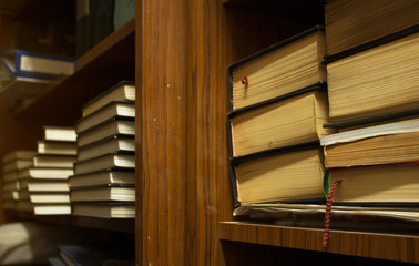 Dusty old stack of papers and files in archive room of office