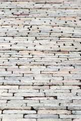 Brick pavement background. Abstract background of old brick pavement in perspective