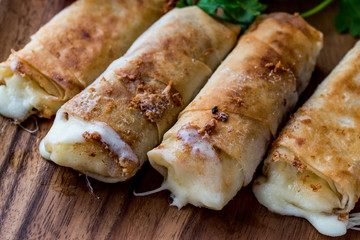 Turkish Pacanga Boregi with pastirma and cheddar (melted) cheese / pastirmali borek