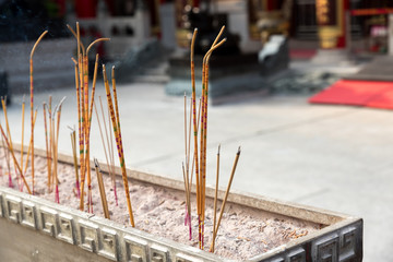 Yellow incense sticks burning at Wong Tai Sin , Chinese Temple, Hong Kong