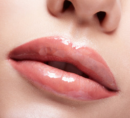 Closeup shot of female mouth with red lips color