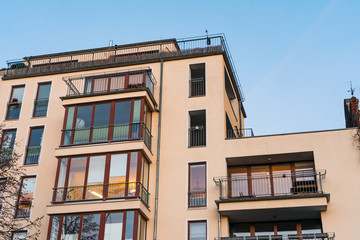 Fototapeta na wymiar beautiful and modern apartment house with colorful glass balcony