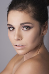 Naklejka premium Beautiful brunette woman with make up. Studio beauty portrait. Fashion style