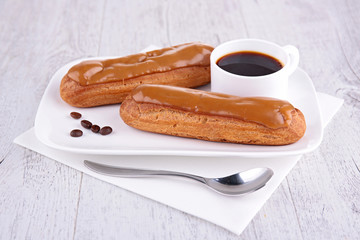 coffee cup with coffee eclair