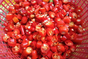 Red shred chili in red basket prepare for cooking.