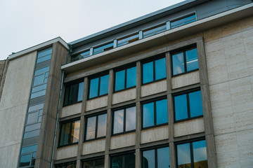 Fototapeta na wymiar old office building with blue clean windows