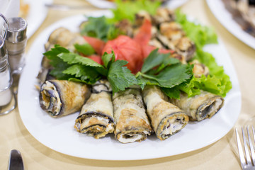 Baked eggplant with sauce and cheese roll